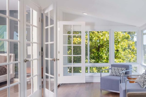 Bright solarium-style sunroom off the master suite.